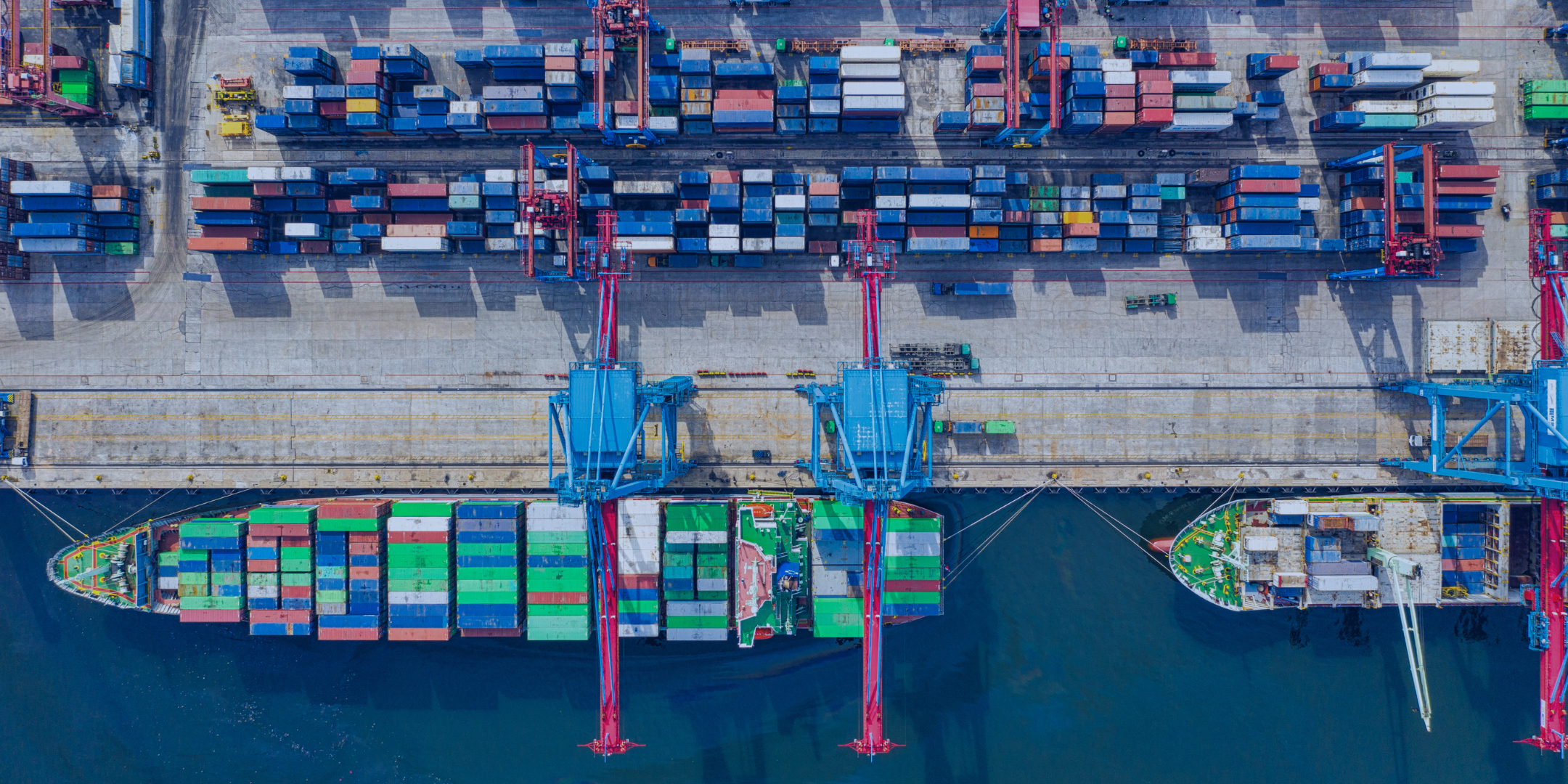 Multicolored image of shipping containers at port.