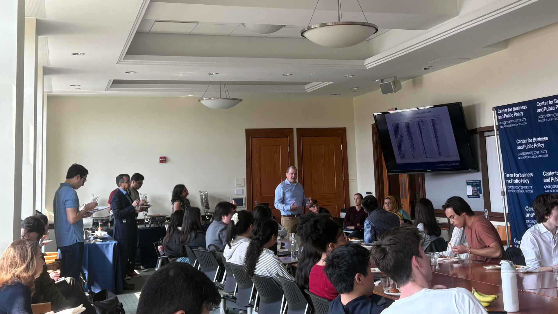 Tim DeStefano and students in discussion.