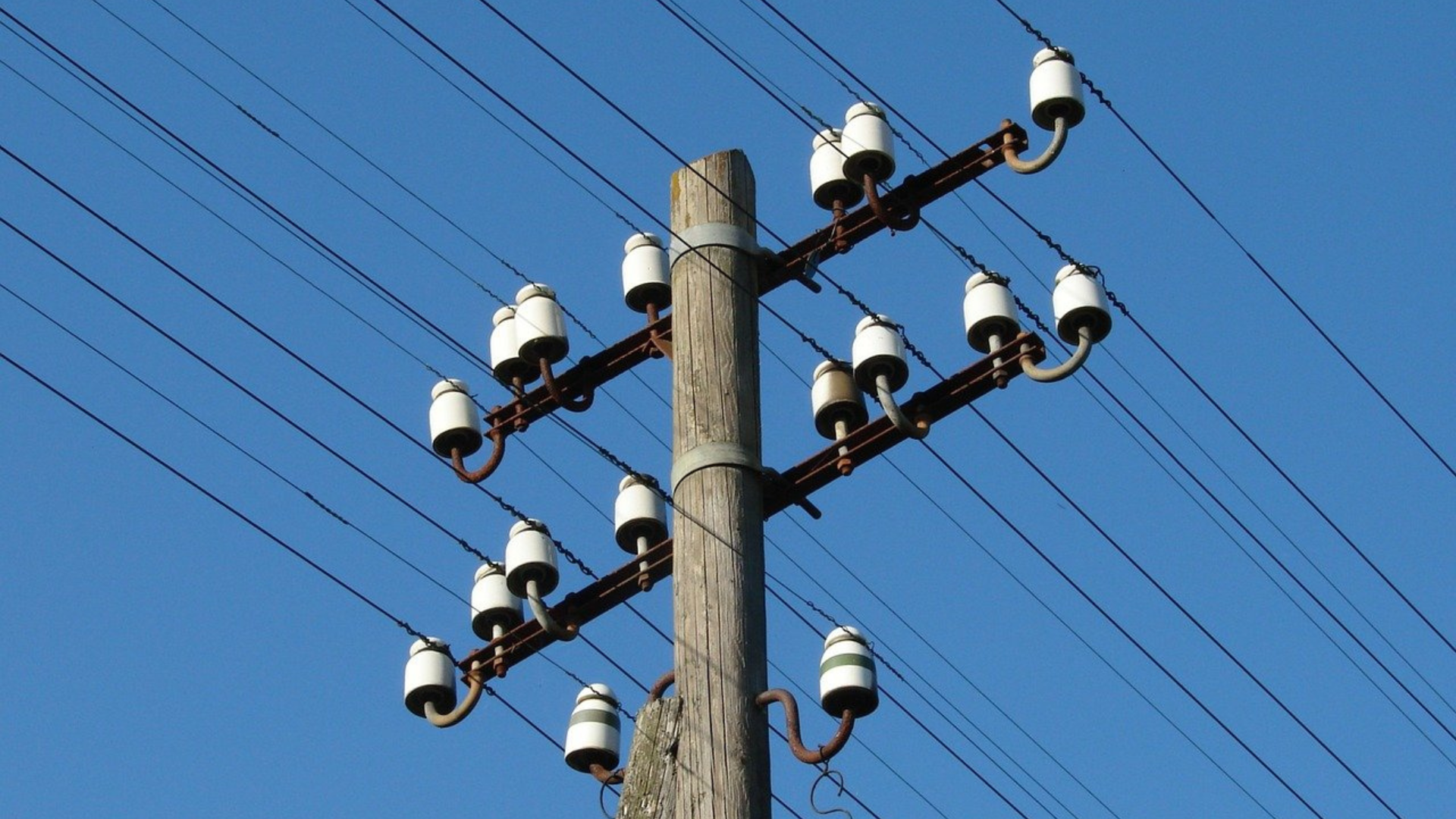 Wireless network tower with lines coming through it.